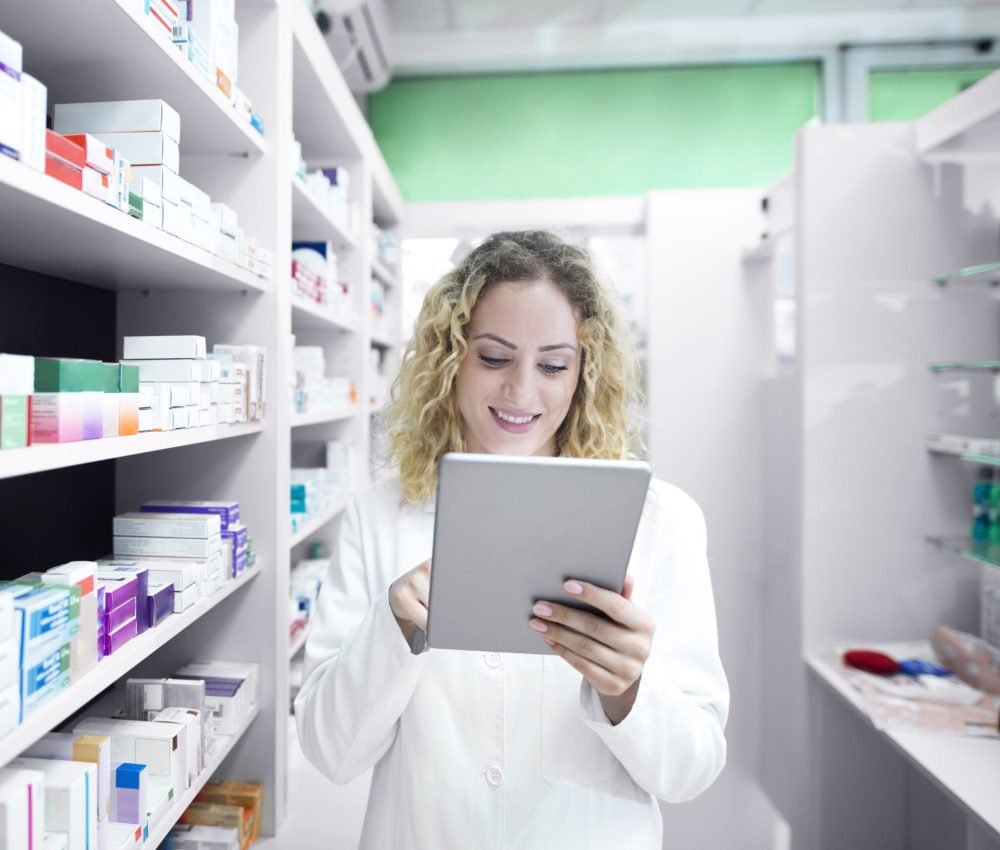 Female pharmacist working in drug store.